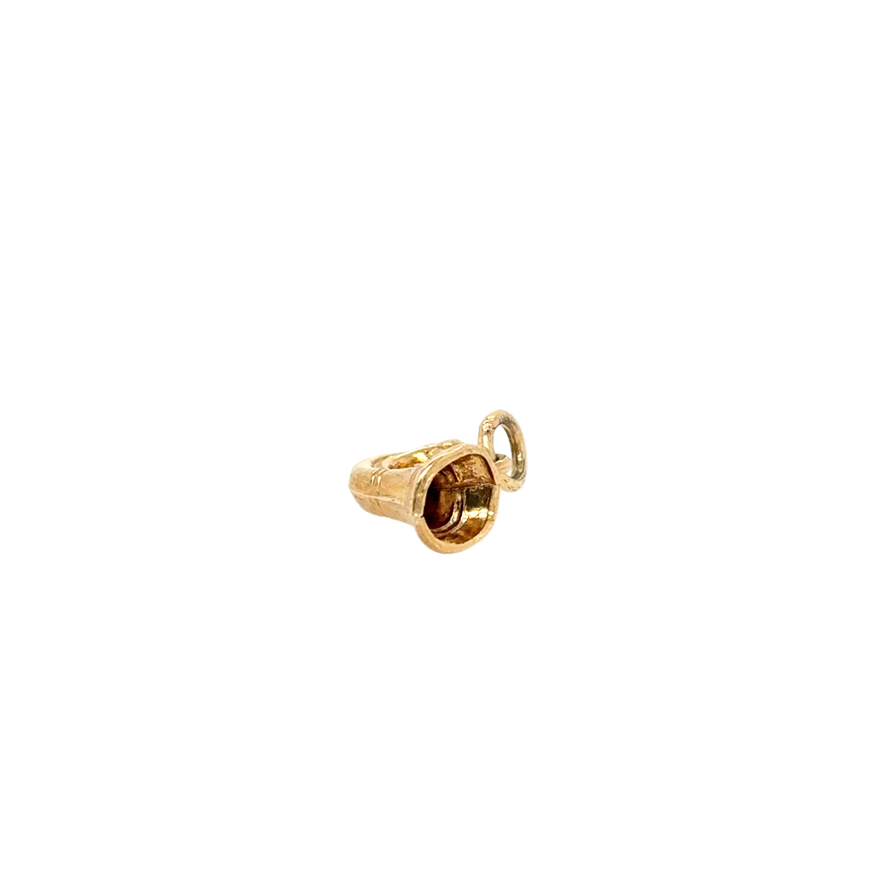 Gold bell charm on a white background
