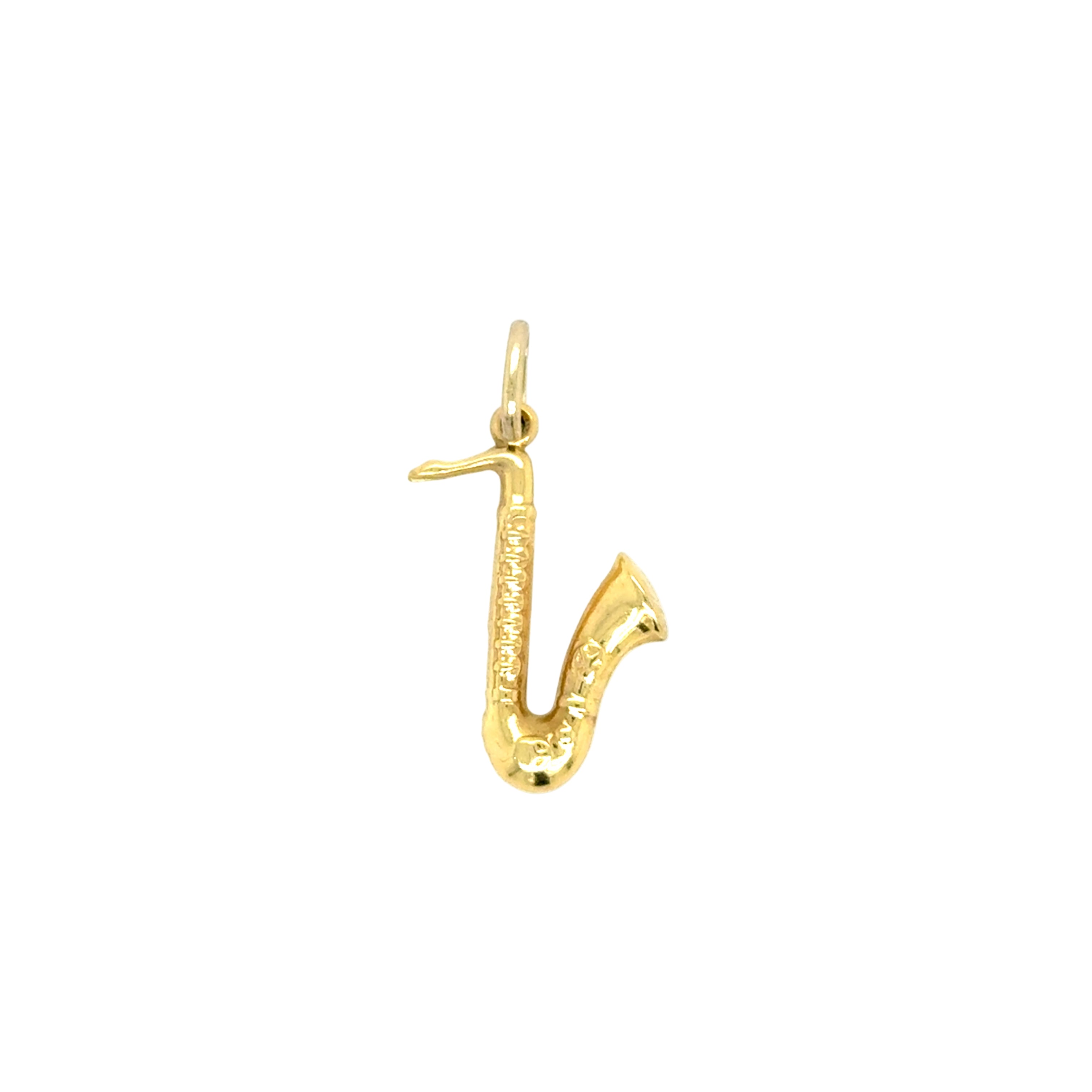 Gold saxophone-shaped pendant on a white background
