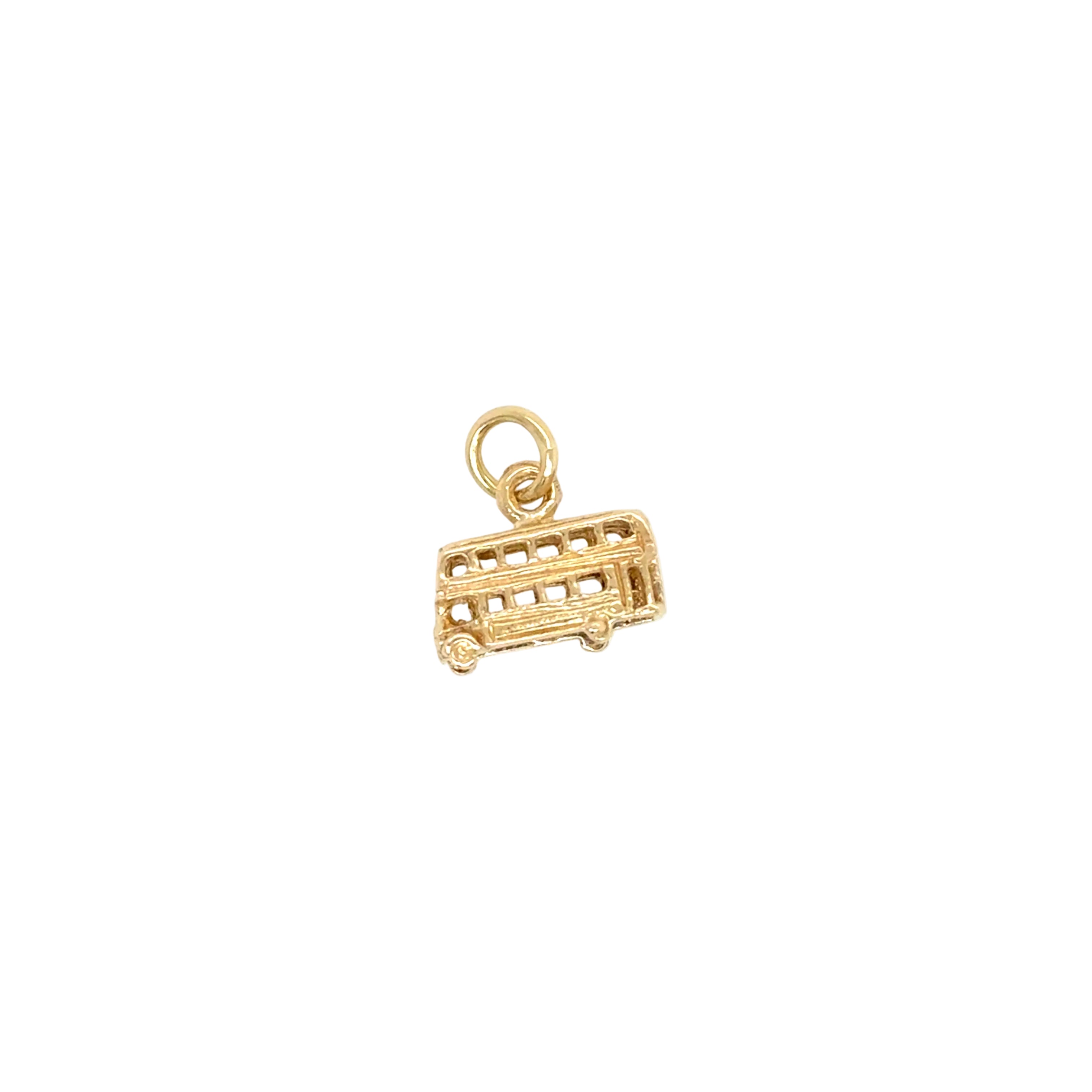 Gold double-decker bus charm on a white background